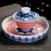 Jingdezhen Azul y Blanco Dunhuang Mil Budas Cerámica Juego de Té Tazón de Té Kung Fu Tendencia Nacional Color Bajo Vidriado Taza de Té Souvenir