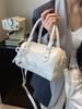 2025 Nuevo Estilo Coreano Moda Bolso Pequeño Portátil para Mujer Bolso Boston Simple Nicho Moda Bolso Cruzado con Texto