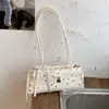 Bolso de mano de alta gama transfronterizo 2026 nuevo bolso de hombro de moda versátil para el trabajo y el día a día bolso tipo baguette para debajo del brazo