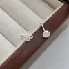 Pendientes Flor de Dinero de Plata Pura S999, Diseño de Nicho, Simples y Elegantes, Pendientes del Año Zodiacal, Accesorios para Orejas Estilo Ins Simples y con Estilo