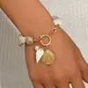 Joyería europea y americana transfronteriza, collar con diseño geométrico de concha y caracola estilo oceánico, conjunto de joyería versátil y de alta gama para mujer