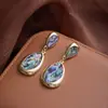 Pendientes Largos de Concha de Abulón en Forma de Gota de Lujo Ligero Transfronterizos Europeos y Americanos para Mujer Pendientes de Botón de Lujo Ligero de Nicho Francés Pendientes Retro de Gama Alta