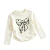 Nueva colección de Primavera y Otoño: Camisetas básicas de manga larga con cuello redondo para niñas, con lindos estampados de moños, disponibles al por mayor