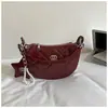 Bolsas de designer de nicho transfronteiriças para mulheres 2026 nova moda bolsa versátil com corrente bolsa tiracolo bolsa de bolinho requintada super popular