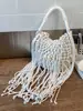 Bolso tejido para mujer, nuevo modelo de verano 2026, bolso de hombro niche y súper popular para el día a día, bolso cruzado con flecos, bolso de playa de paja