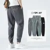Calça Casual Masculina de Seda Gelada Nove Pontos Calças Masculinas Verão Fina Estilo Hong Kong Tendência Esportiva Perna Larga Respirável Calças de Verão