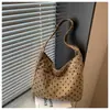 Bolso de hombro versátil de estilo coreano de nicho transfronterizo para otoño 2026, nuevo para mujer, con textura de lunares, simple