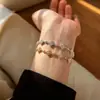 Pulsera de trébol de cuatro hojas de circón de la suerte, lujo ligero, exquisita y elegante, accesorio de mano artístico, versátil para ir al trabajo, accesorio de nicho