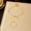 Pulseira Anel de Corrente Fina Dourado Brilhante Venda Quente Europeia e Americana Transfronteiriça Aço Inoxidável Banhado a Ouro Sensação de Alto Padrão Joia de Mão Feminina