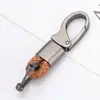 Llavero coche herrajes cuerda tejida metal colgante de alta gama hombres y mujeres parejas cuero de microfibra resistente al desgaste Accesorios Al por mayor