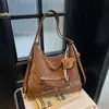 Nova Bolsa Pão de Camurça e Veludo Outono/Inverno Bolsa de Ombro Único Retro de Alta Qualidade Bolsa de Ombro Cruzado Criativa de Personalidade para o Trabalho