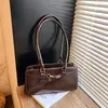 Fivela de Cinto de Alta Qualidade Estilo Garota Popular Transfronteiriça Bolsa de Ombro para Mulheres 2026 Nova Retrô Versátil para o Dia a Dia