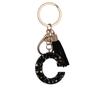 Llavero de resina negra de venta caliente transfronteriza, colgante de 26 letras inglesas, colgante simple de borla, colgante para mochila al por mayor