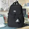Bolsa de monedas de oso de color block de gran capacidad, elegante y simple, mochila escolar 25 modelo nuevo para niñas de secundaria y preparatoria
