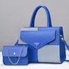 Nuevo fabricante de bolsos al por mayor bolso de moda versátil bolso para ir al trabajo bolso madre-hija de un solo hombro con bloques de color bolso de gran capacidad