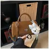 Bolsa quadrada pequena simples transfronteiriça feminina moda retrô bolsa de ombro sob o braço bolsa transversal versátil popular para o dia a dia