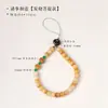 Cordão de celular Bodhi emparelhado com uma pequena fruta de bodhi amarela, uma nova corrente de celular estilo chinês e um acessório de pulso com contas estilo chinês