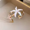 Pulsera abierta de encaje de estrella con goteo de aceite de metal transfronteriza, estilo vintage europeo y americano, joyería de lujo ligero y sensación de alta gama