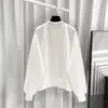 Sudadera negra de retazos irregulares estilo europeo para mujer, nueva versión coreana para primavera y otoño 2026, jersey holgado y versátil sin capucha