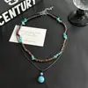 Set de collar de hilo de cera de coco y turquesa de moda europea y americana para mujer, cadena de suéter en capas de nicho hip-hop, joyería transfronteriza para hombre