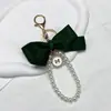 Item Quente de Celebridade da Internet Chaveiro Pingente Grande Laço de Pérola Tecido de Fita Colorida Tecida Nó de Tecido Charme para Bolsa Atacado