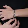 Pulseira de cristal azul-marinho em forma de cruz, de dupla camada, um acessório moderno e versátil para homens e mulheres, adequada para o uso diário e para adicionar um toque de luxo discreto.