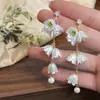 Pendientes coreanos elegantes y dulces, diseño de nicho elegante, flor pequeña, borla larga, lujo accesible, moda versátil para mujer
