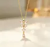 Colar Pingente Gota Zircônia Roxa Banhado a Ouro Cobre Design de Nicho de Luxo Leve Estilo Francês Transfronteiriço para Mulheres Corrente de Aço Titânio Corrente de Clavícula