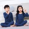 Em estoque Roupas íntimas térmicas infantis cor sólida gola redonda terno de veludo Shu infantil conjunto de pijamas sem costura para meninos e meninas estudantes do ensino fundamental