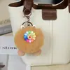 Chaveiro de Pelúcia com Rosto Sorridente e Flor Colorida Boneca Bola de Pelo Fofa Pingente para Bolsa Mochila Carro