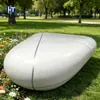 Banca con incrustaciones de acero inoxidable y terrazo con forma de huevo, silla de arte para césped escénico, hecha a medida para paisajismo de bienes raíces
