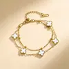 Pulsera exquisita de acero de titanio de 9 mm con trébol de cuatro hojas de doble capa para mujer, no se decolora, nueva moda de doble cara de lujo ligero, versátil y elegante