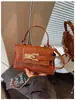 Bolso de mano para mujer transfronterizo 2026 nuevo modelo comercio exterior bolso pequeño cuadrado popular bolso Kelly versátil bolso de hombro cruzado