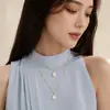 Joyería transfronteriza europea y americana cadena de semillas de melón collar con forma de gota de agua de perla moda femenina nuevo collar simple de doble capa