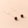 Brincos de fio de orelha redondos de cinábrio para mulheres, design de nicho, versátil para o dia a dia, novo estilo chinês, longos, com franja, brincos de ano de nascimento