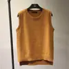 Chaleco de punto dividido, suelto y combinable para otoño e invierno, cárdigan de color liso para mujer, suéter sin mangas, chaleco exterior con cuello redondo.