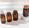 Botellas de medicina de boca ancha color té hechas a medida y frascos de vidrio para envasado, sellados y a prueba de luz, para tabletas y cápsulas, fabricante de botellas de vidrio