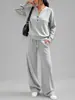 2026 Roupa feminina transfronteiriça europeia e americana outono e inverno nova moda top solto de manga comprida e calça de perna larga conjunto casual esportivo de duas peças