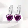 Comercio electrónico transfronterizo venta de exquisitos pendientes de moda amor color tesoro hebilla de oreja estilo reina diosa joyería de oreja fabricantes al por mayor