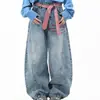 Jeans de retazos a cuadros estilo retro americano con dobladillo curvo para mujer, nuevo estilo primavera 2026, pantalones holgados de pierna ancha hasta el suelo