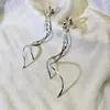 Aretes largos con flecos personalizados, aretes tipo clip de disco espiral para mosquitos, modernos y de alta gama, aretes estilo ins súper de hada, versátiles