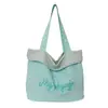 Bolsa de mano casual de nailon estilo coreano, bolso de mano de moda con estampado de letras, popular bolso de hombro de rayas reversible para mujer