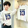 Camiseta de manga comprida para meninos, algodão puro, novo estilo primavera/outono 2026, cor sólida, gola redonda, top de base para crianças mais velhas