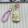 Nuevo Modelo Oro Puro 999 Oro Atrae Fortuna Flor Dinero Llavero Cordón de Cuero Cadena para Teléfono Colgante Decoración de Bolso Regalo