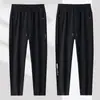 Calça de moletom masculina de corte reto, estilo primavera e outono, com bolsos com zíper, calça comprida casual, calça larga solta, calça esportiva jogger de outono