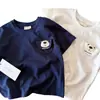 Camiseta de Verano de Manga Corta para Niños Estilo Nuevo 2026 Oso de Dibujos Animados para Bebé Cuello Redondo Camiseta Básica Top Casual para Niños Tendencia