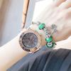 Reloj de pulsera para mujer, de oro, de marca china, de acero inoxidable, elegante reloj de pulsera con decoración de tres ojos.