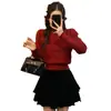 Top elegante de cuello redondo estilo coreano para primavera y otoño con mangas abullonadas y entallado en la cintura, suéter de punto liso hueco de invierno para mujer