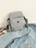 Bolsa de Ombro Pequena Impermeável de Tecido de Nylon Estilo Japonês Simples 2025 Nova Leve Casual Bolsa de Ombro Masculina e Feminina Leve para Celular