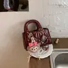 Bolsos de Mujer de Moda 2026 Nuevo Bolso de Hombro Cruzado de Primavera Diseño de Nicho Bolso Personalizado Bolso Cuadrado Pequeño Simple